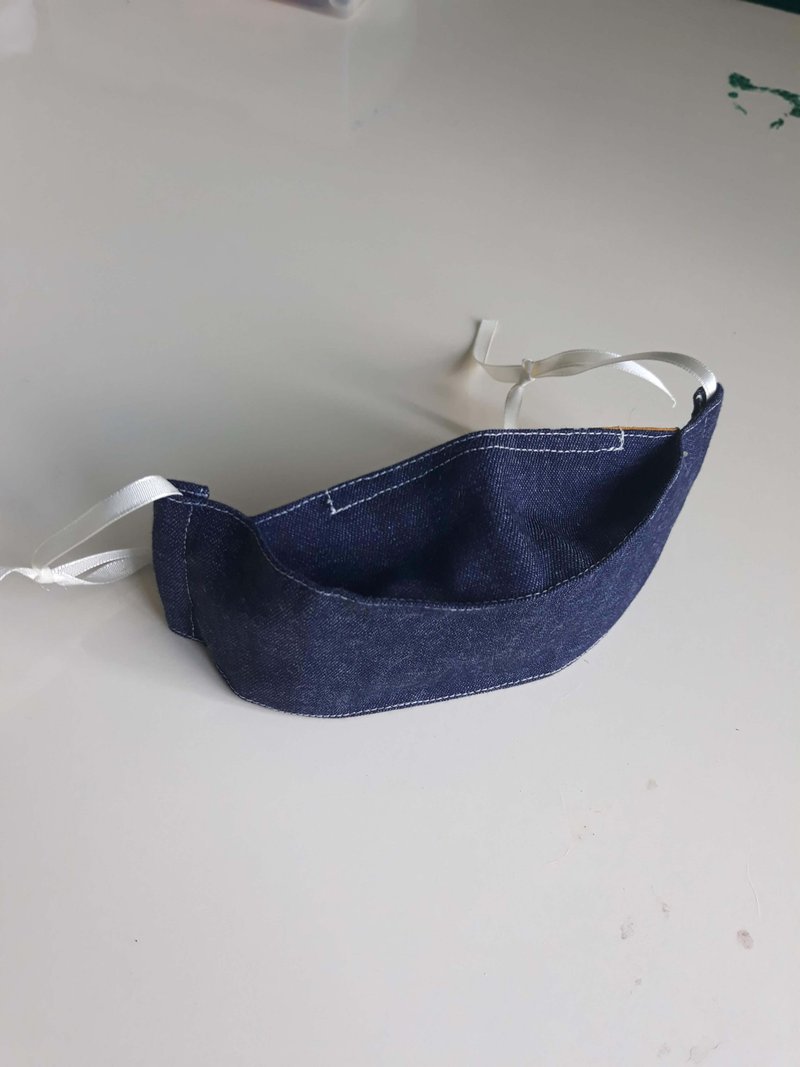 Face mask made of jeans or chambray fabric with ribbons that goes over your ears