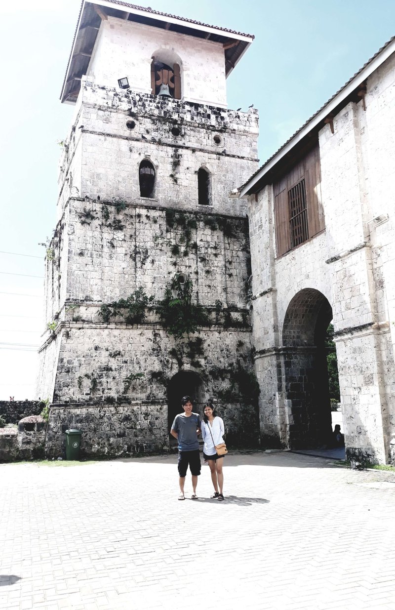 A young couple in front of Baclayon Church