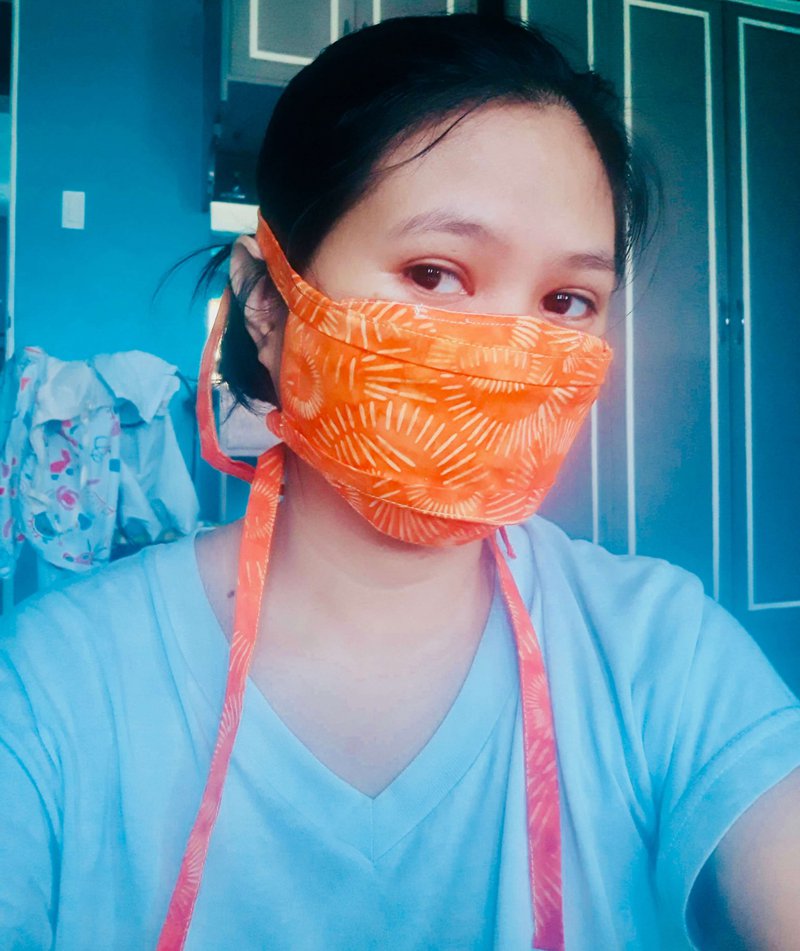 Face mask with orange burst print