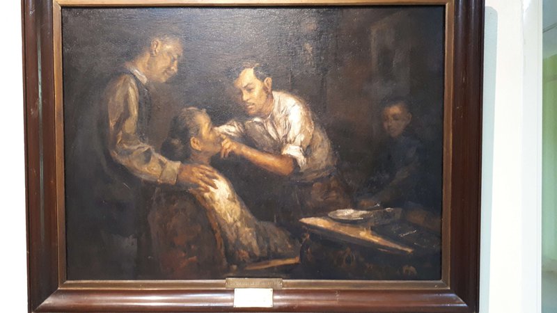 a painting depicting Rizal treating his mother